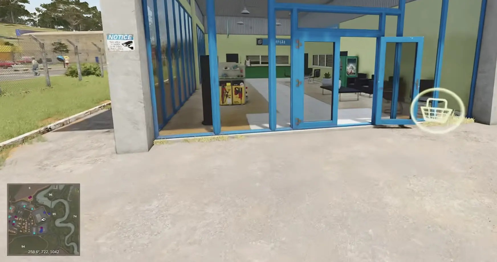 Blue glass entrance with a shopping interaction icon in the vehicle shop area of Catuaí