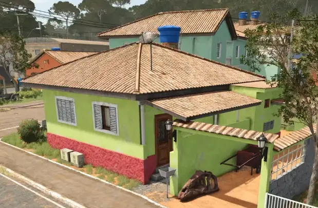Exposed dinosaur bone in the courtyard beside a green-painted house in Catuaí